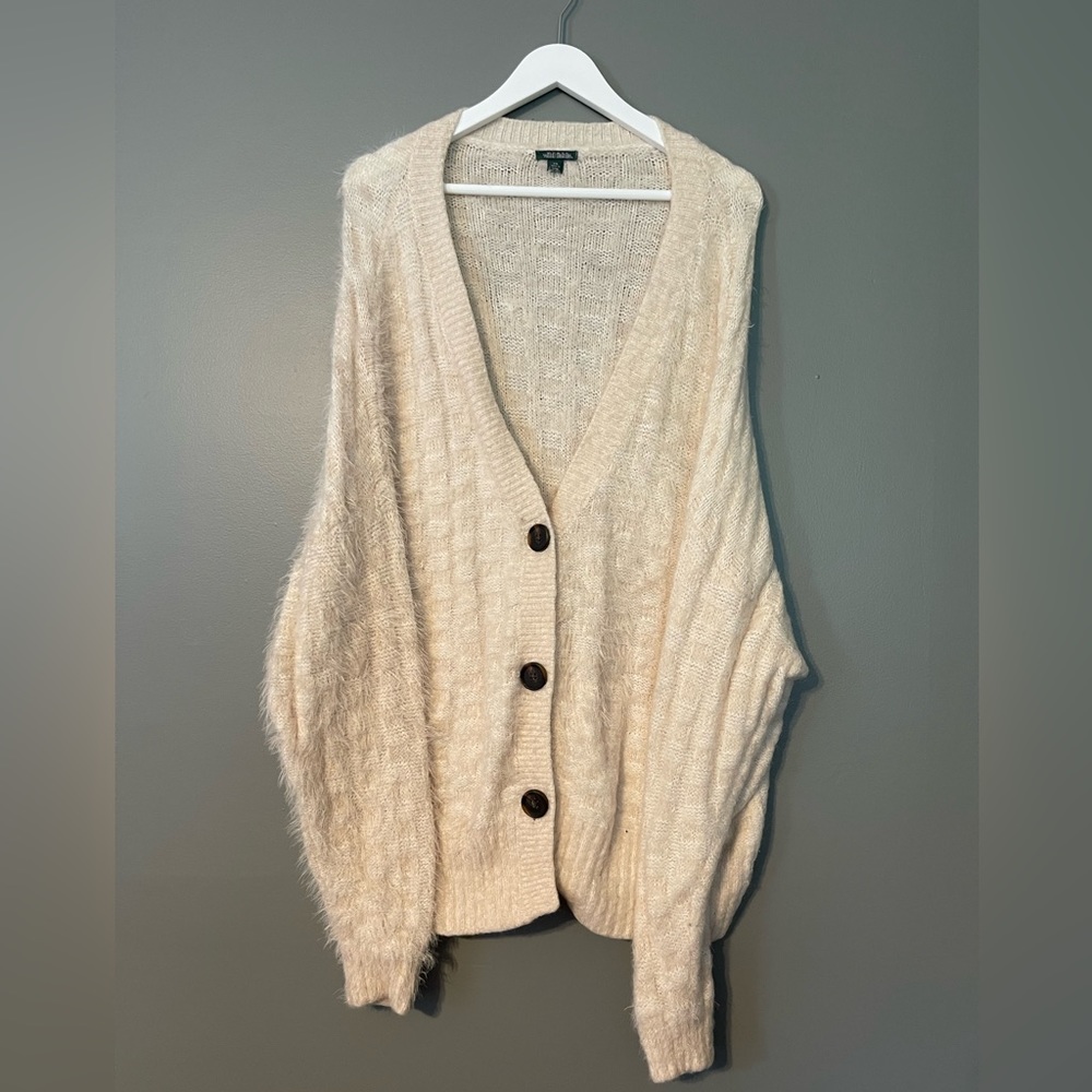 Cream colored. Super soft cardigan. With buttons